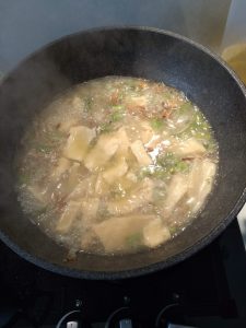 Mee Hoon Kueh cooking in the soup